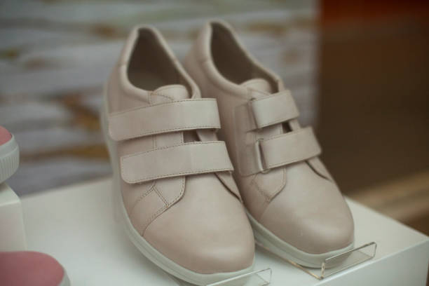 istock Women's shoes on display. Lightweight shoes without logos. 1350241693