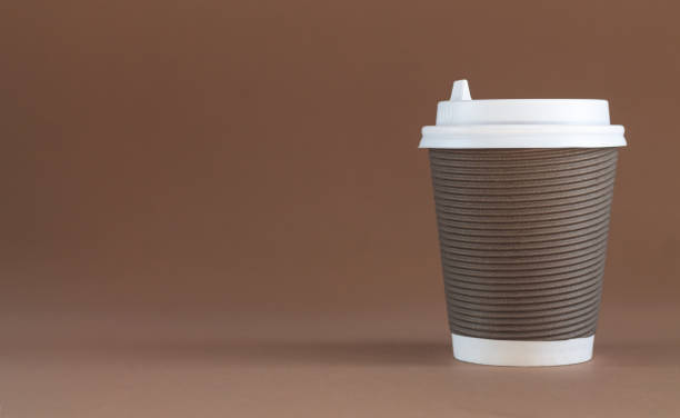 istock One paper disposable coffee cup with cap 1350242601