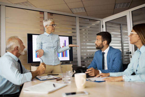 istock Business team in discussion over new business project 1350243864