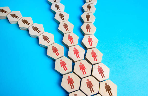 istock People are divided into several directions. Concept of conflict and disunity. Disintegration of a community group. Main stream branching . Segmentation. Society partition. Confrontation, opposition 1350245881