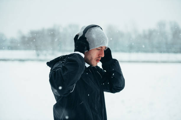 istock Handsome young man running and training on a cold winter day 1350248722