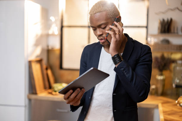 istock Black man watching something on smartphone 1350249806