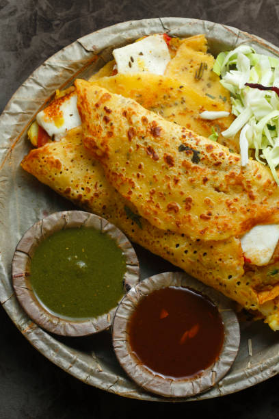 Moong Dal Cheela Moong Dal Cheela with stuffed paneer indian dinner stock pictures, royalty-free photos & images