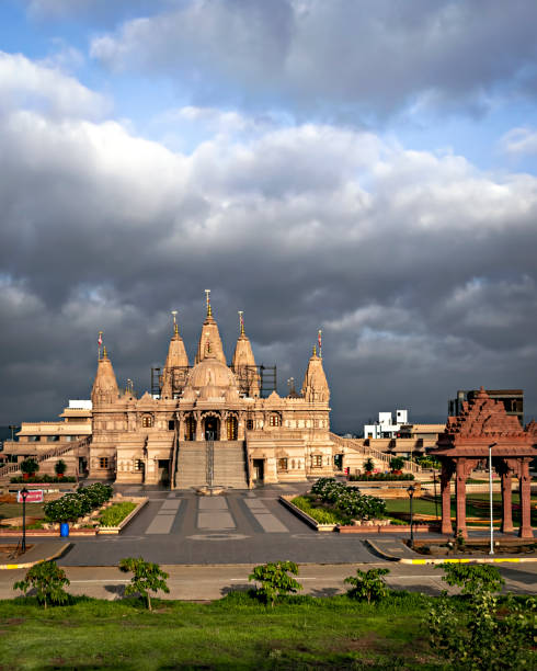 istock Crowd less Swaminarayan temple on a clear sunny day with clouds background in Ambegaon, Pune, Maharashtra, India. 1350253398