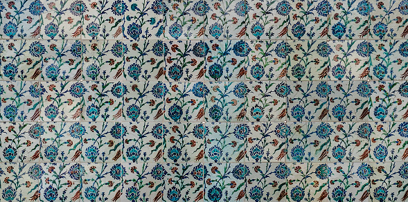 The texture of the ceramic tiles in the oriental style. Turkish ceramic tiles lined up on the wall.