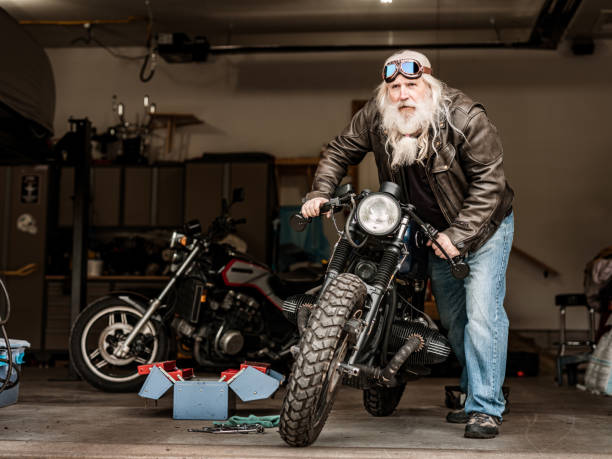 istock Senior man working on his vintage motorcycle 1350253907