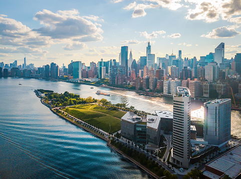 Aerial of Roosevelt Island and Four Freedoms state park downtown Manhattan on a cloudy day. New York aerial