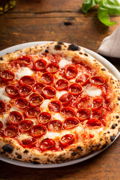 istock Freshly baked Neapolitan pizza with pepperoni and mozzarella 1350259412