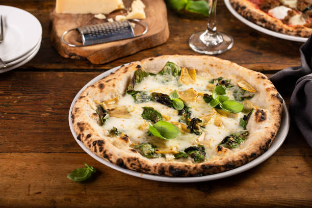 istock Pizza bianca or white pizza with artichokes and basil 1350259474