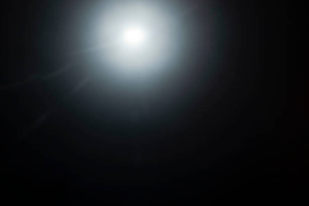 istock A flash of light in the dark. black background 1350262111