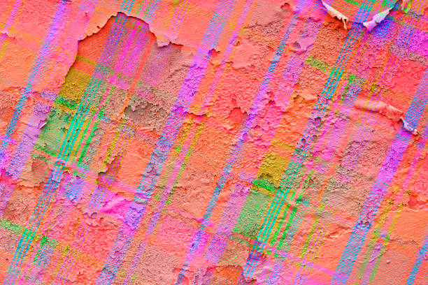 An old peeling wall painted in graffiti style with bold colors
