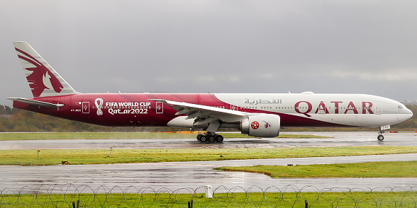Manchester, United Kingdom - 29 October, 2021: Qatar Airways Boeing 777-300ER (A7-BEC 'FIFA World Cup Qatar 2022) on arrival at Manchester Airport.