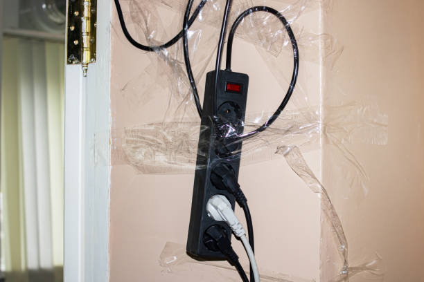 istock Extension cord with plugs glued to the wall 1350267517