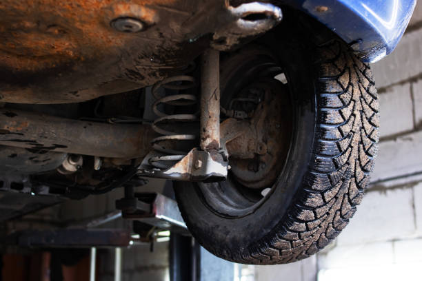 istock Car on lift in car service, wheel closeup 1350268145