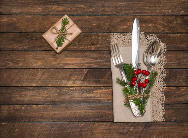 istock Christmas table place setting  with spoon, knife, fork and napkin. Holidays new year background with copy space. 1350269330
