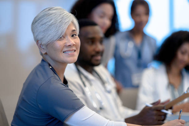 istock Female Nurse During a Meeting 1350270594