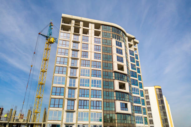 istock High residential apartment building under construction. Real estate development. 1350271788