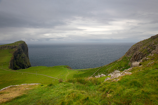 Landscape of cliffs at Moonen Bay on Neist Point, close to the lighthouse on the Isle of Skye in Scotland.