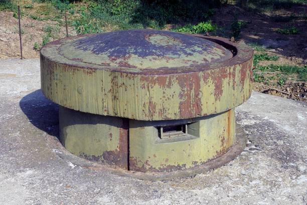 istock one old military green rusty iron tower with embrasures on a gray concrete pillbox 1350272921