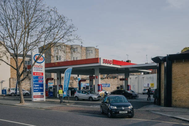 Car exiting a esso petrol station in Fulham, London stock photo
