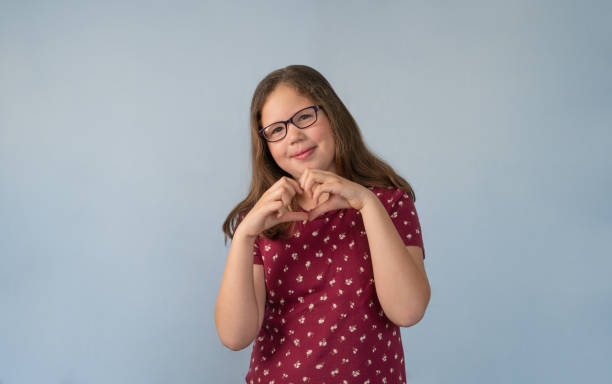istock Girl Making Heart with Hands 1350278190