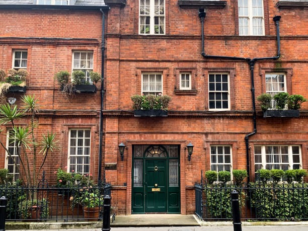 House in Mayfair, London Facade of old victorian red brick house in Mayfair, London Mayfair stock pictures, royalty-free photos & images