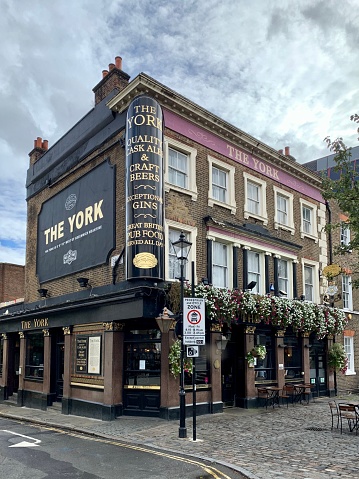 LONDON, ENGLAND. Fragment of facade of The York pub in Angel area in London. 19th century pub previously known as The York Hotel. Selective focus. Vertical
