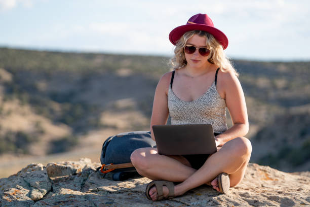 istock Woman Working On Her Computer And enjoying The Beautiful Nature Around Her 1350289793