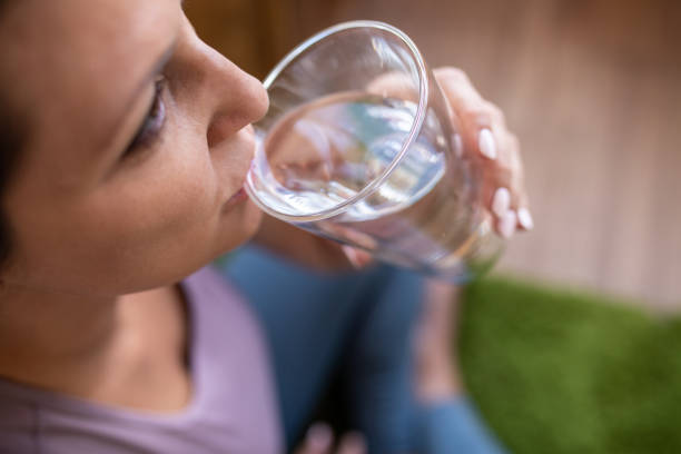 istock Woman Drinking Water After Workout 1350290604