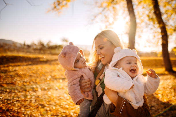 Happy mother and twin babies