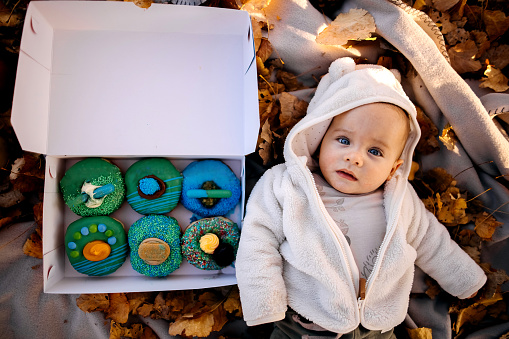 Cute child in autumn leaves