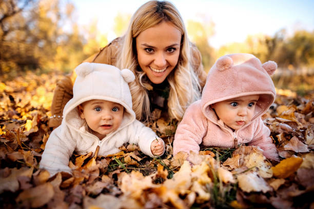 istock Mother with her two baby 1350295052