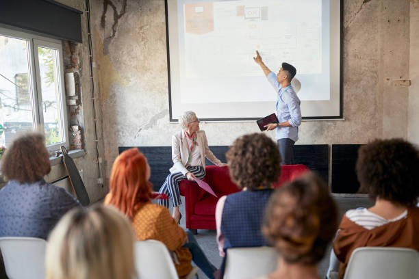 istock A young man is holding a presentation for his colleagues in the office 1350304548