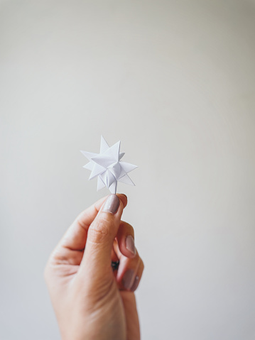 Origami Froebel star, or Advent star, a German paper star for Christmas decoration