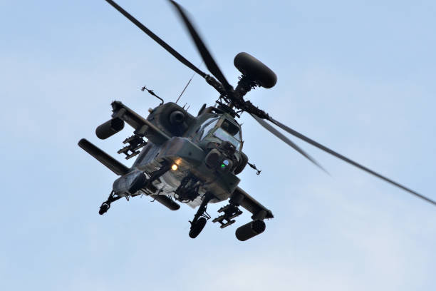 Ibaraki, Japan - May 17, 2015:Japan Ground Self-Defense Force Boeing AH-64D Apache Longbow attack helicopter performing an exhibition flight at the Camp Kasumigaura Air Festival.