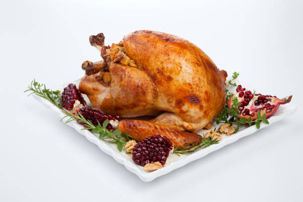 istock Pomegranate Glazed Roasted Turkey on White 1350325081