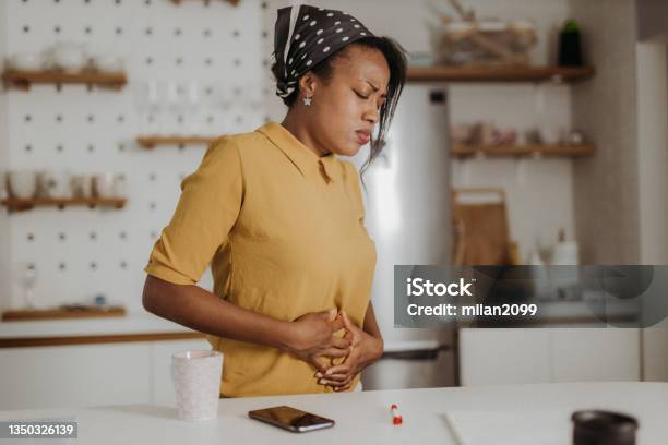 Pain Stock Photo - Download Image Now - Stomachache, Women, One Woman Only