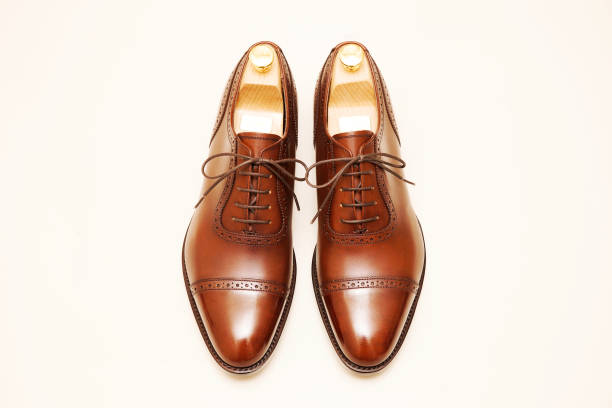 istock New brown leather shoes with shiny toes. 1350327320