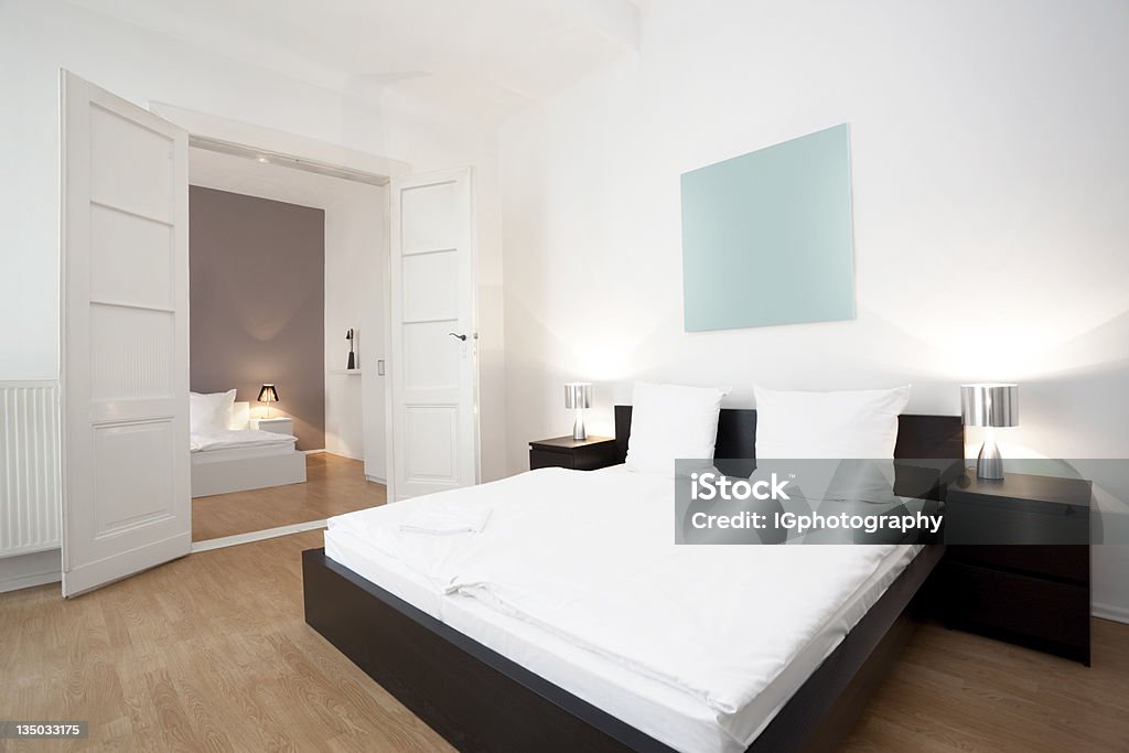 Luxurious Bedroom in Spacious and Modern Apartment Home. Luxurious bedroom in spacious and modern apartment home. Mattress Stock Photo