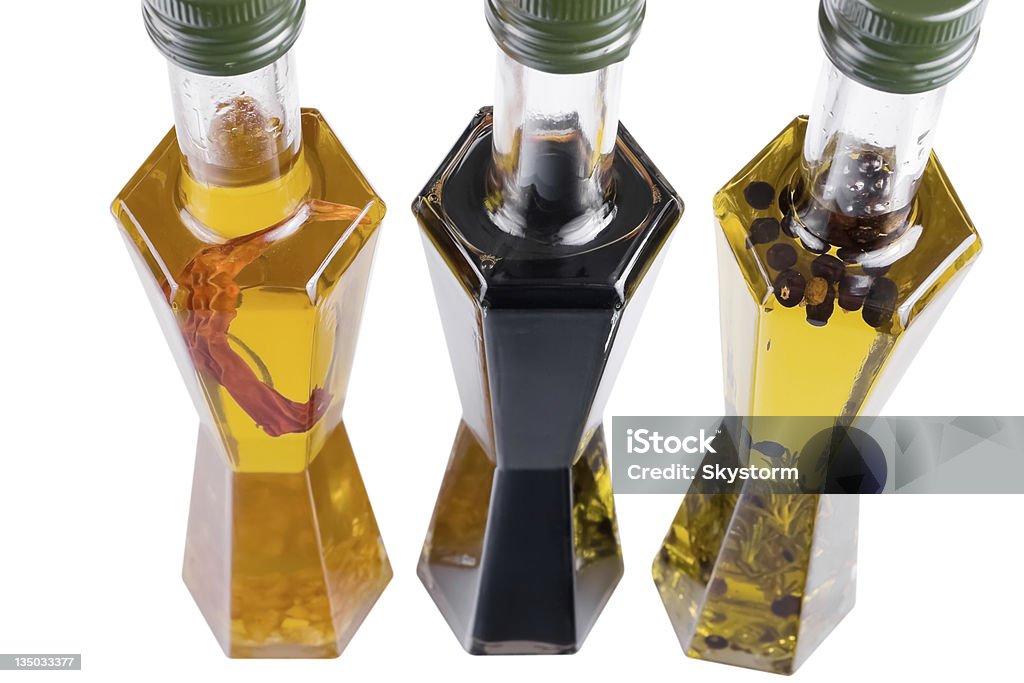 Different edible oils Different edible oils into bottles filled Balsamic Vinegar Stock Photo