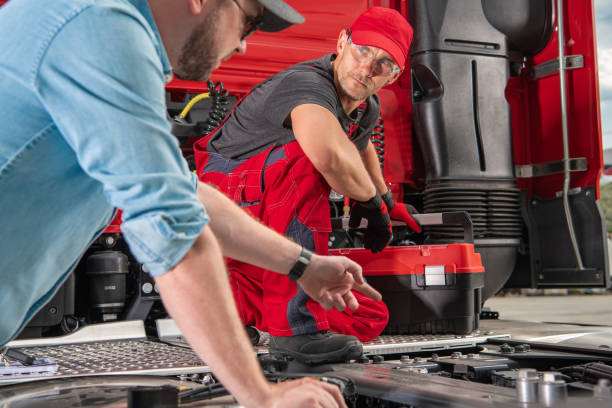 istock Truck Driver Pointing the Issue to His Mechanic 1350334607