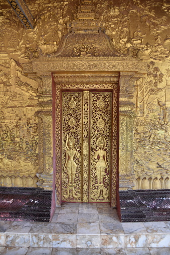 Ornate wall and door at Luang Prabang temple