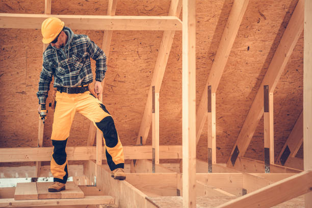 istock Construction Contractor Inside Newly Built Wooden House Skeleton 1350335455