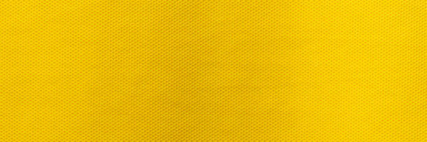 yellow color sports clothing fabric football shirt jersey texture and textile background, wide banner. - basketball sports uniform jersey textile imagens e fotografias de stock