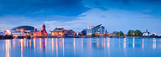 Cityscape, Cardiff Bay Pretty night time illuminations of the stunning Cardiff Bay, many sights visible including the Pierhead building (1897) and National Assembly for Wales. ProPhoto RGB for precise colour reproduction. cardiff wales stock pictures, royalty-free photos & images