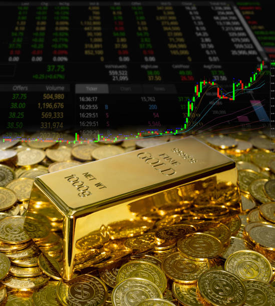 istock Gold bullion on the coin at trading chart background 1350344873