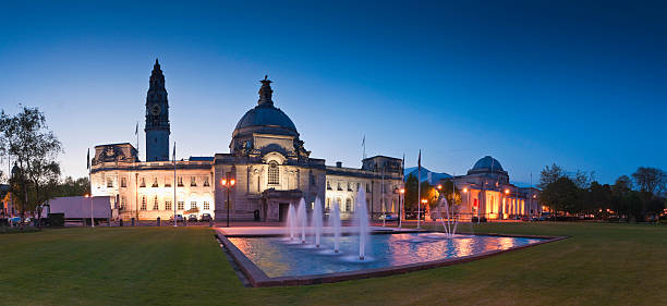 City Hall, Cardiff Cardiff City Hall (1906) and fountains at night in the heart of the capital, city Museum to the right. ProPhoto RGB for precise colour reproduction. cardiff wales stock pictures, royalty-free photos & images