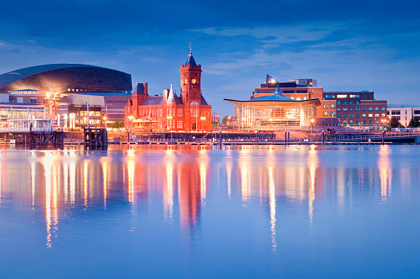 Cardiff Bay Cityscape Pretty night time illuminations of the stunning Cardiff Bay, many sights visible including the Pierhead building (1897) and National Assembly for Wales. ProPhoto RGB for precise colour reproduction. cardiff wales stock pictures, royalty-free photos & images