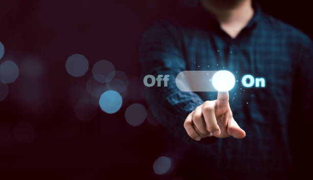 Businessman touching to virtual toggle switch button for change from off to on. Businessman touching to virtual toggle switch button for change from off to on. turning on or off photos stock pictures, royalty-free photos & images