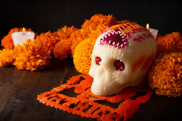 istock mexican sugar skull and flowers 1350357454